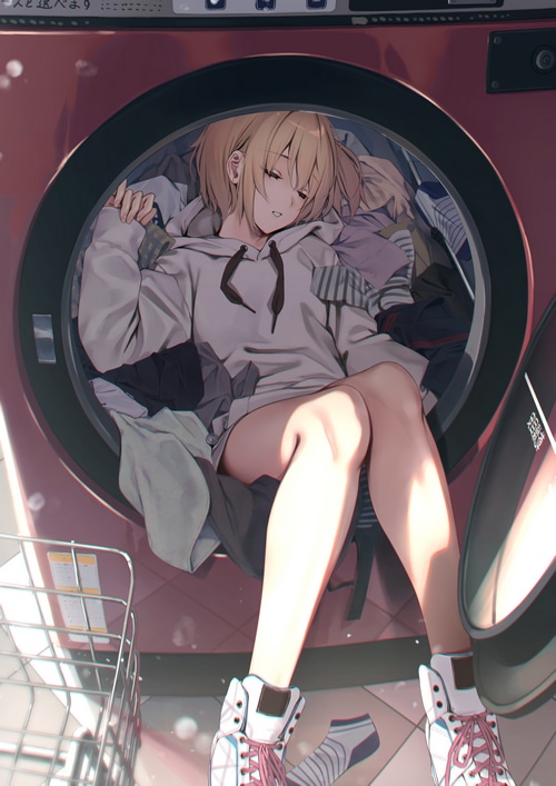 Girl sleeping in a washing machine