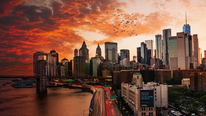 New York City skyline and Brooklyn Bridge at sunset