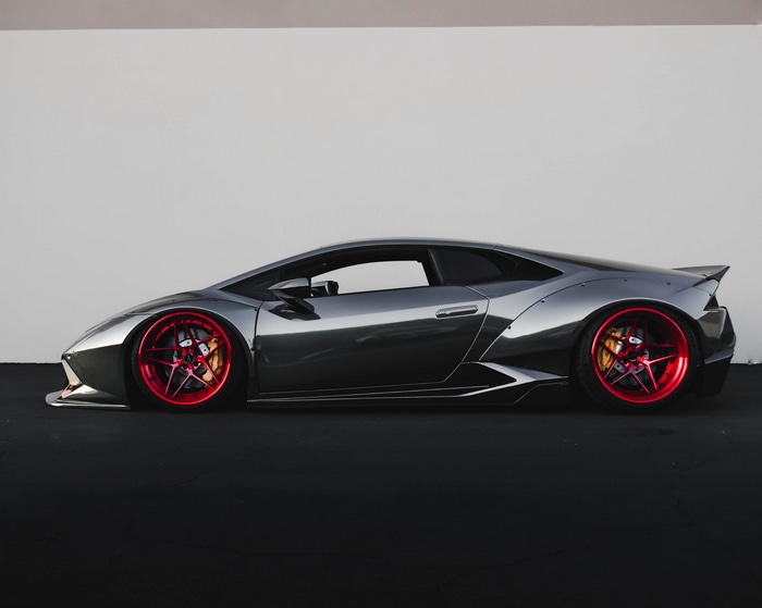 Gray Lamborghini Huracan with red wheels