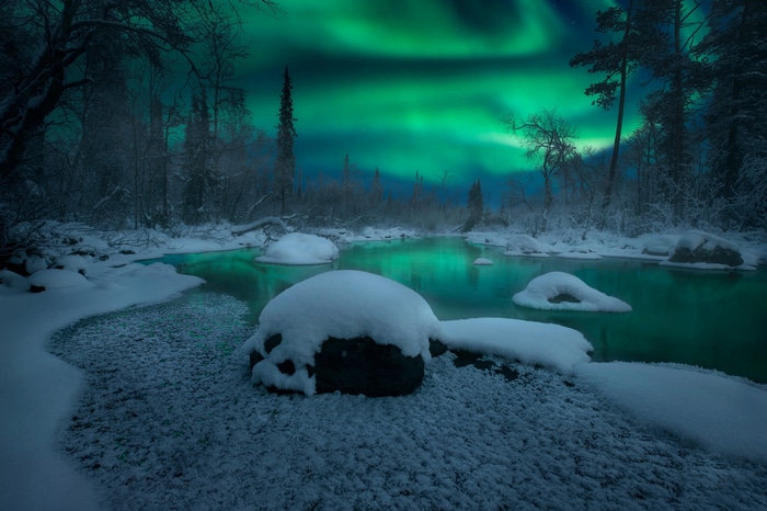 Aurora Borealis over a snowy river in Russia