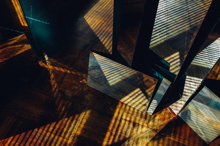 Yan Senez indoors on a wooden floor