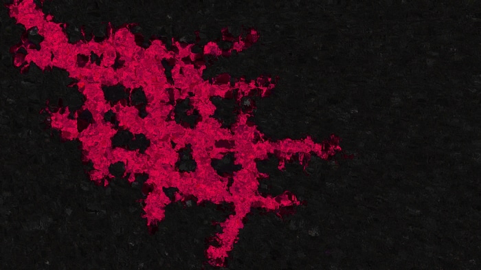 Abstract red pattern on dark textured background