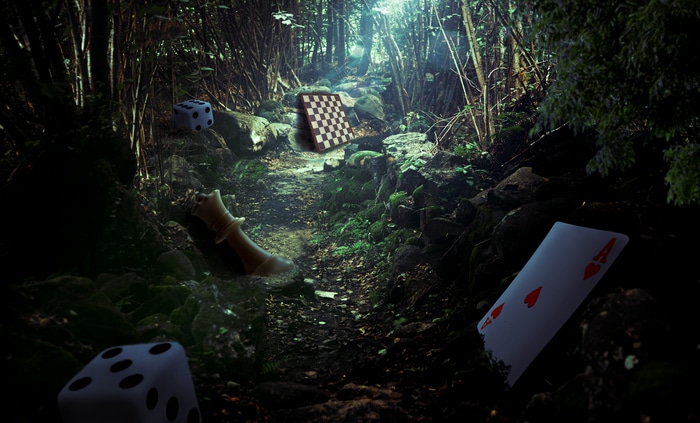 Forest path with dice, chess, and playing cards