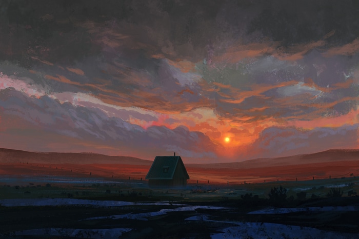 Sunset over a field with a small cabin
