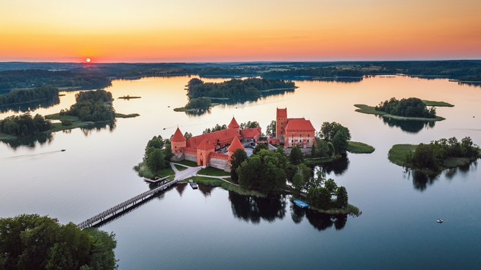 4K aerial view of Trakai Island Castle in Lithuania at sunset