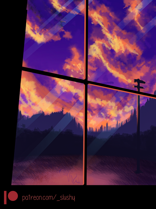 Sunset viewed through a window with mountains