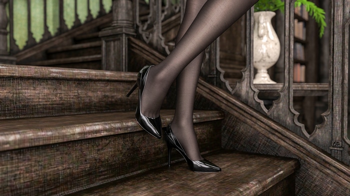Woman's legs in black heels on wooden stairs