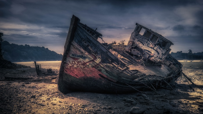 4K old boat wreck on a beach