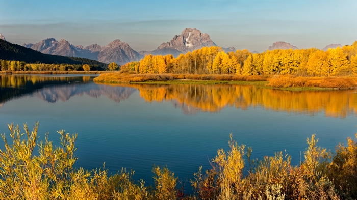 4K lake reflection of autumn trees and mountains