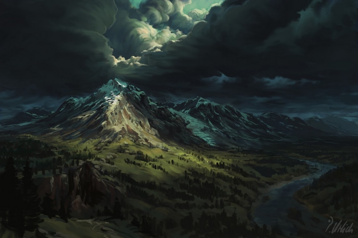 Stormy clouds over snow-capped mountains and a river valley