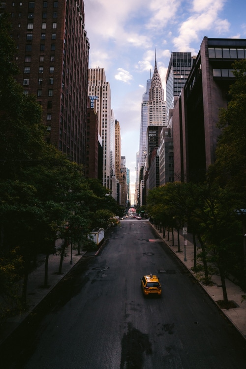 Chrysler Building and yellow taxi on a New York City street