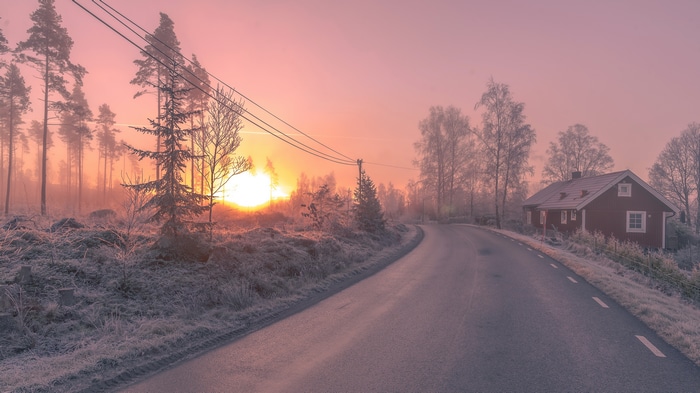 4K Winter Sunrise Over Frosty Road and Red House