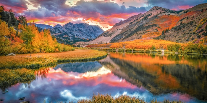 Autumn sunset over mountains and a lake