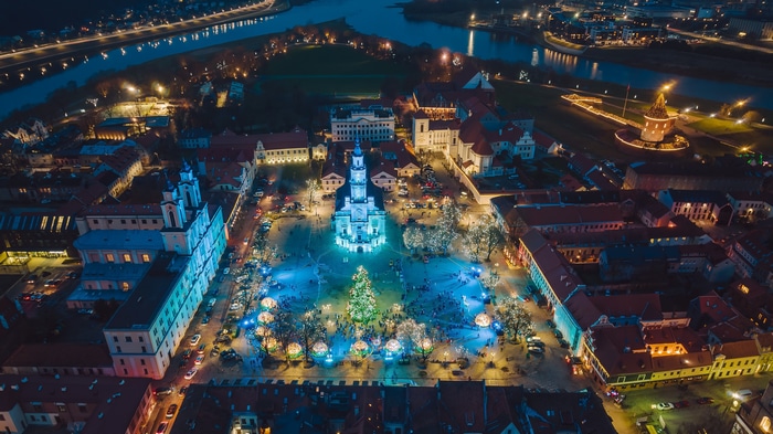 4K aerial view of Kaunas Christmas market and city lights