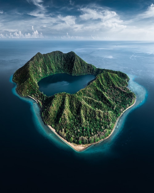 Island with a lake in the middle surrounded by mountains and sea