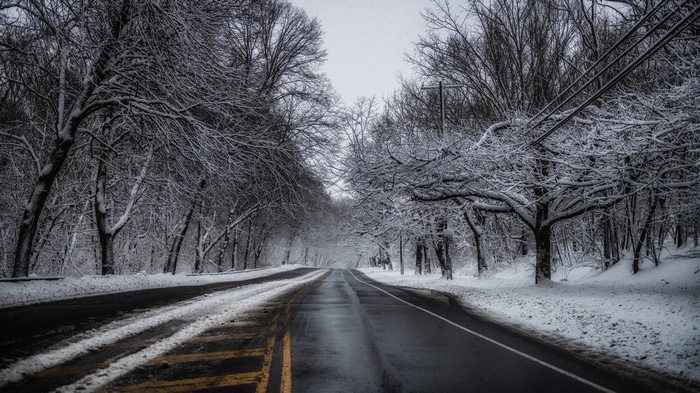 4K winter road covered in snow and ice
