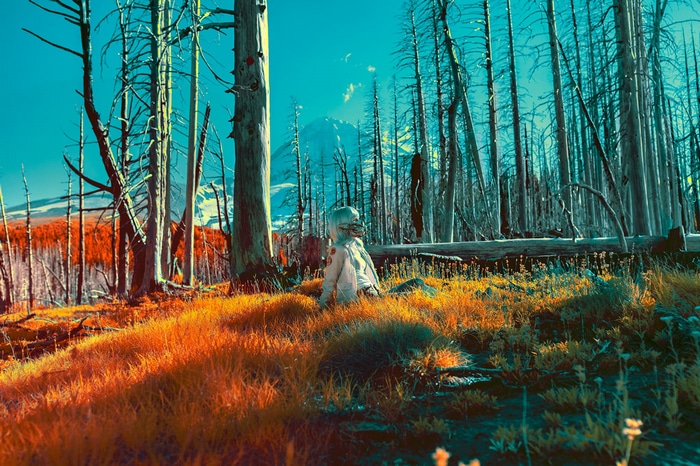 Mako Miyamoto in a spacesuit in a forest