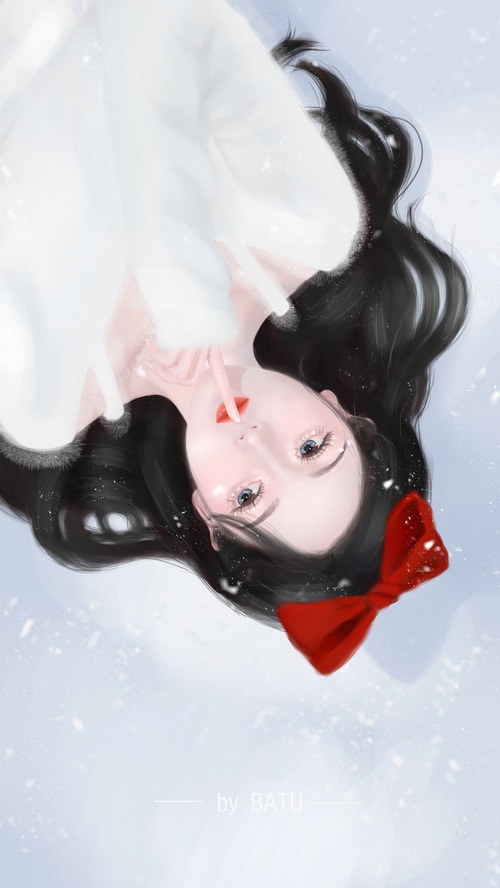 Woman with black hair and red bow in snow