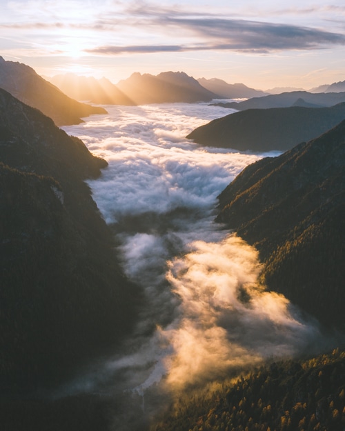 Mountains shrouded in clouds at sunset