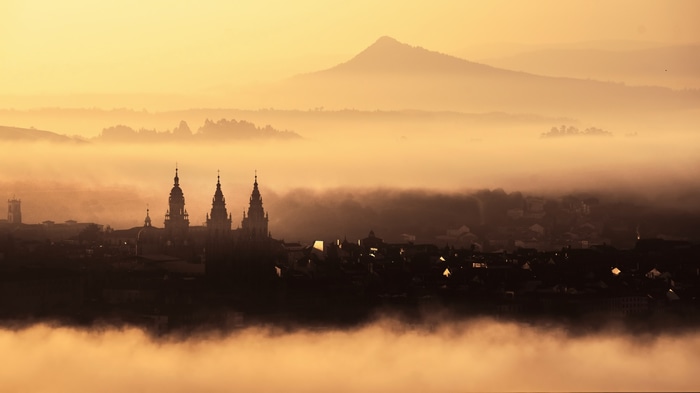 Santiago de Compostela cityscape in mist at sunrise