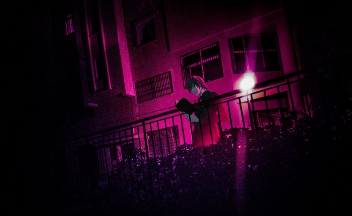 Yagami Light reading a book on a balcony at night