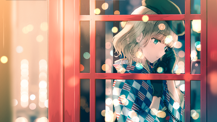 Girl in a phone box talking on the phone