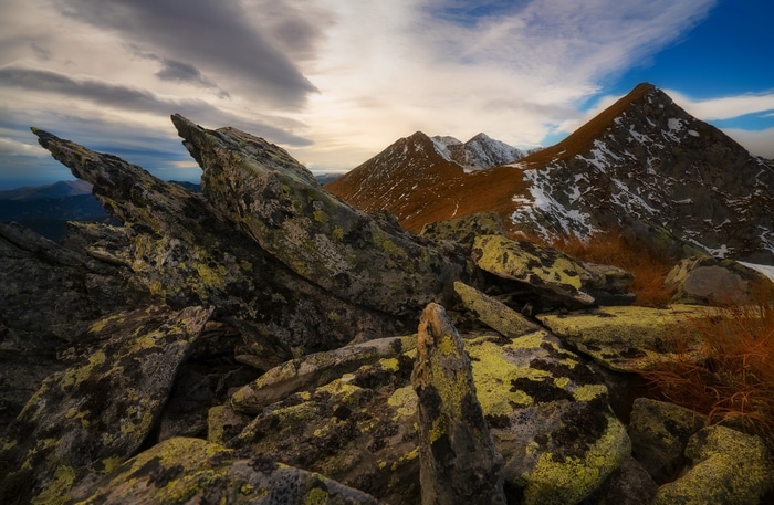 Rocky mountain landscape with snow and clouds