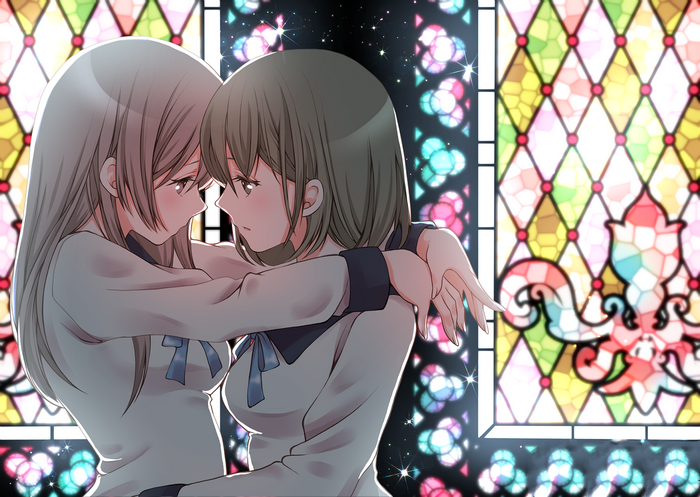 Two girls in school uniforms embracing near stained glass