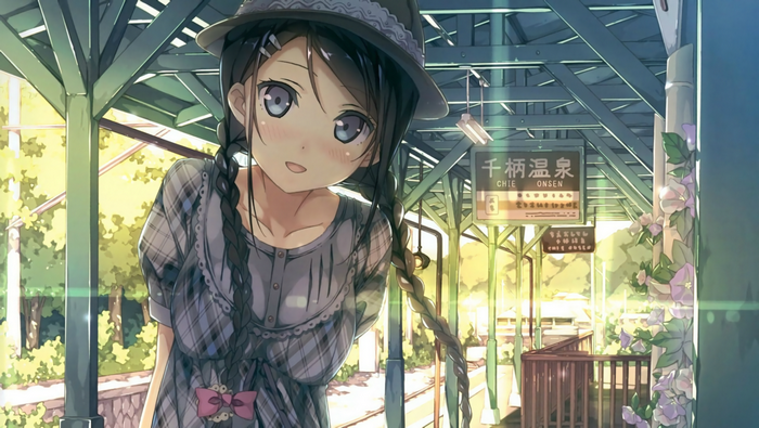 Girl with braids wearing a hat and dress at a train station