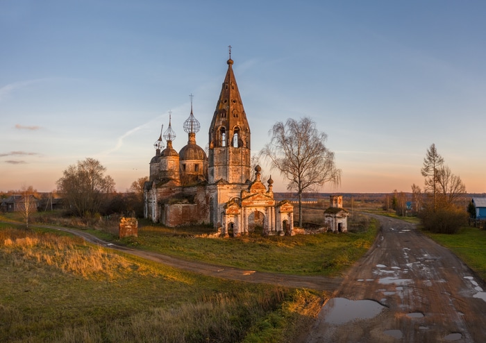 Abandoned church in a Russian village at sunset