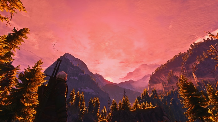 Geralt of Rivia in a mountain landscape at sunset