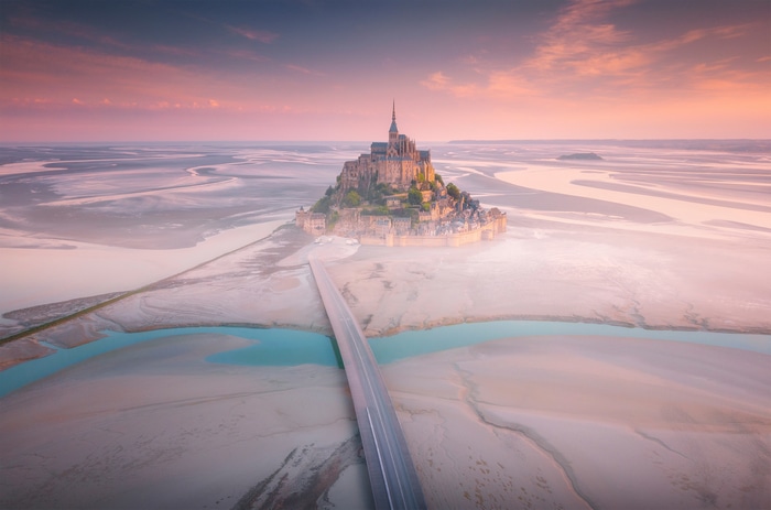 Mont Saint-Michel Abbey aerial view at sunrise