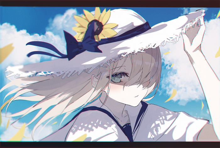 Girl in a sun hat with a sunflower