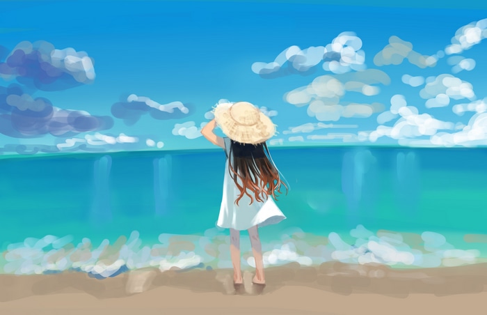 Girl in straw hat and white dress on beach