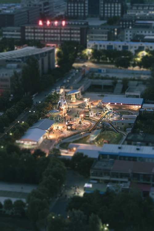 Amusement park at dusk with tilt shift effect