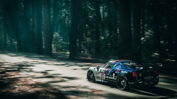 Alfa Romeo 4C race car in a forest