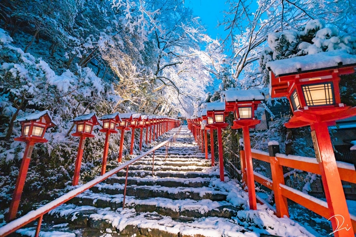 Snowy steps with red lanterns in Japan
