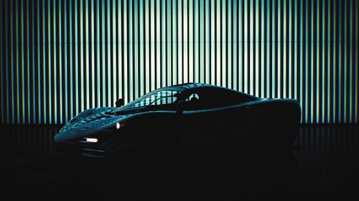 McLaren F1 car in front of a striped background