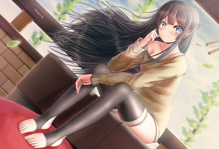 Sakurajima Mai smiling in a tan sweater
