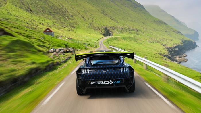 Ford Mustang Mach-E driving on a scenic road