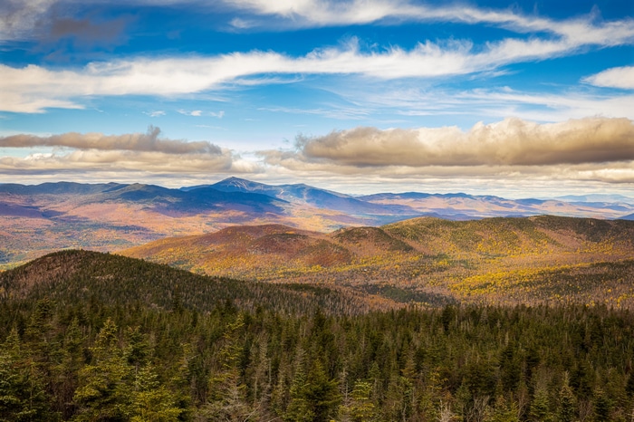 4K fall mountains landscape with clouds and forest