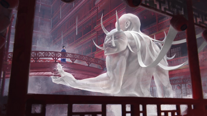Giant demon statue in front of Asian architecture