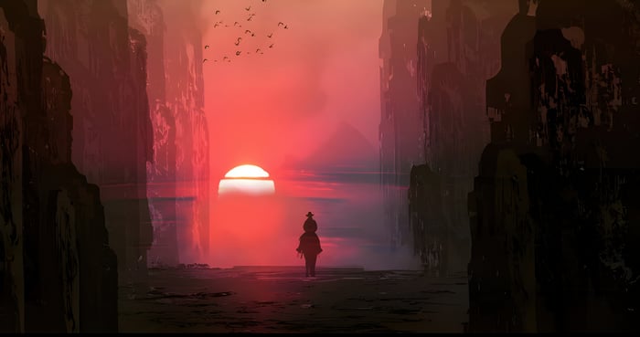 A lone figure rides towards a vibrant sunset between canyon walls.