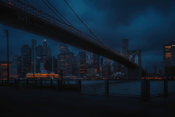 Brooklyn Bridge at night with New York City skyline