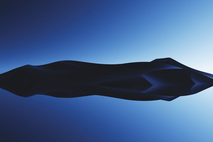 Minimalist dark landscape with reflection on water