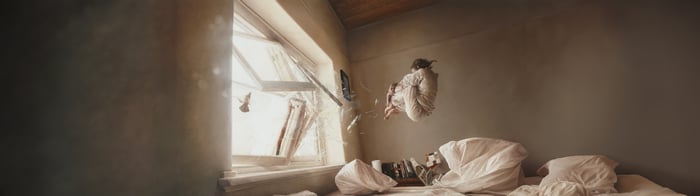 Shattered Freedom: A Woman Levitates Near a Broken Window