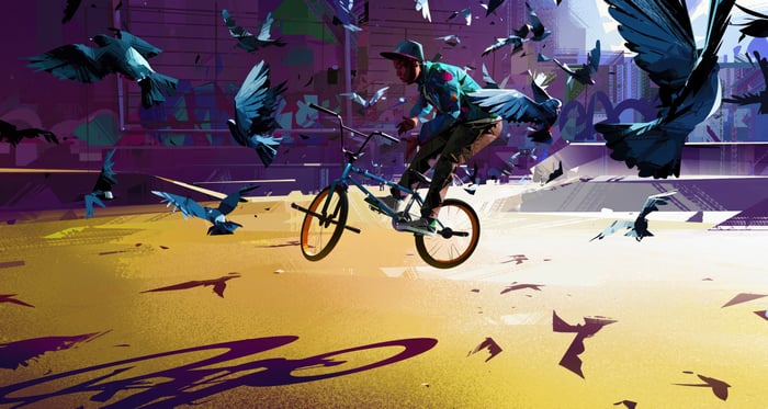 BMX rider performing a trick surrounded by birds