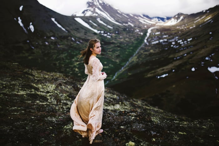 Girl in a dress in a mountainous landscape