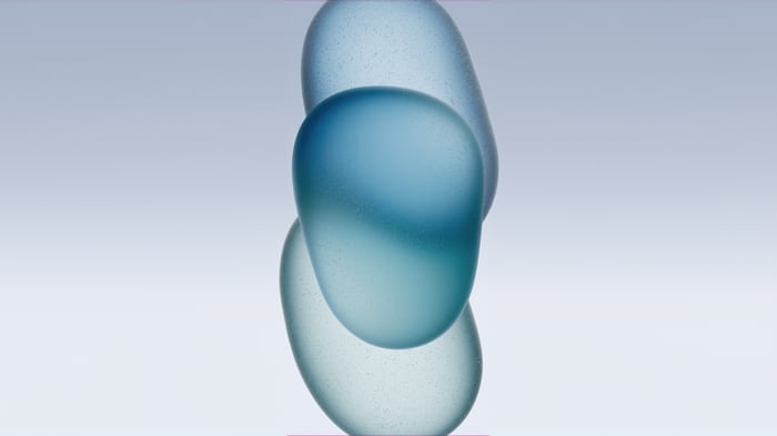 Three frosted glass shapes on a light blue background