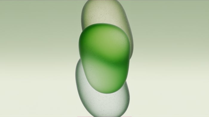 Frosted glass shapes on a green background
